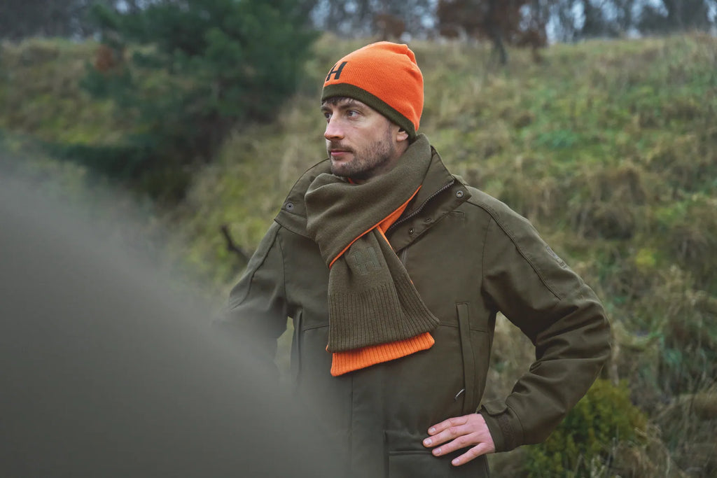 Härkila reversible beanie - Willow green/Orange