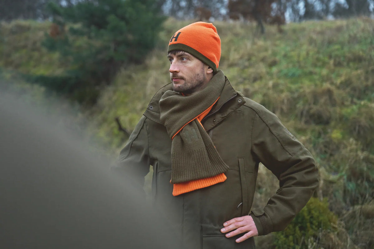 Härkila reversible beanie - Willow green/Orange
